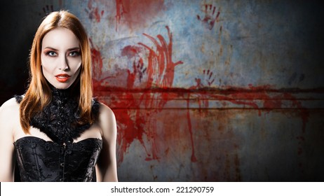 Female Vampire In Front Of A Bloody Wall