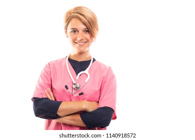 Female vet wearing pink scrub standing with arms crossed isolated on white background with copyspace advertising area