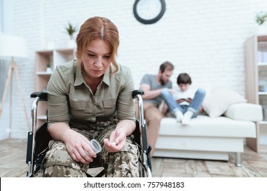 A Female Veteran In A Wheelchair Is Depressed. She Is Trying To Commit Suicide. A Woman In Uniform Is Suffering.