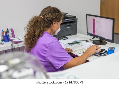 Female Veterinarian Working At The Office With The Computer 