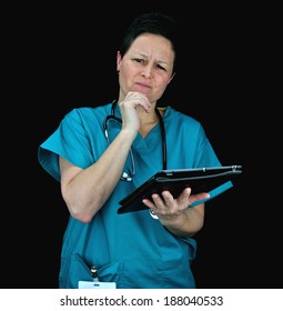 Female Vet/nurse Using A Tablet For Assessment