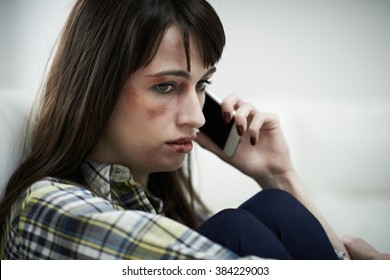 Female Victim Of Domestic Abuse Phoning Support Group