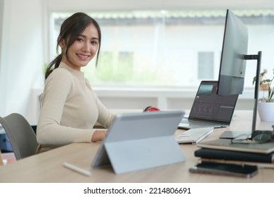 Female Video Editor Working On Professional Computer In Creative Studio Office.