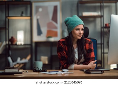 Female Video Editor Works Indoors In Creative Office Studio.