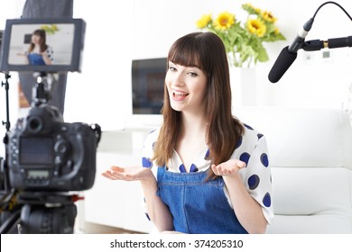 Female Vlogger Recording Broadcast At Home - Powered by Shutterstock