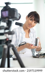 Female Vlogger Recording Computer Repair