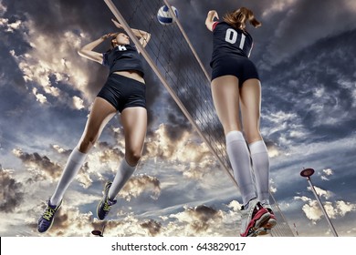 Female volleyball players jumping close-up