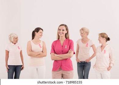 Female volunteers participating in breast cancer awareness - Powered by Shutterstock