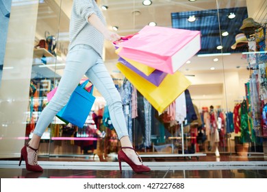 Female Walking In Shopping Mall