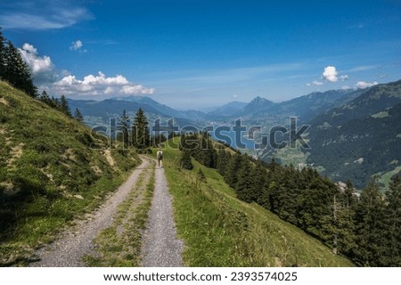 Female wander in nature above lake Lungern, Switzerland