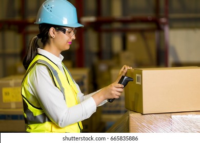 Female Warehouse Worker Checking Delivering Boxes. Distribution Center. Logistics Concept. 