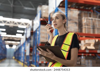 Female warehouse worker holding clipboard during working in storage warehouse. Warehouse worker inspecting quality of products on shelf pallet and checking stock inventory - Powered by Shutterstock