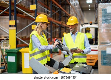 Female warehouse worker learns how to use forklift with instructor - Powered by Shutterstock