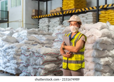 A Female Warehouse Worker Wear A Mask In Alum Or Chemical Warehouse Storage. International Export Business Concept.