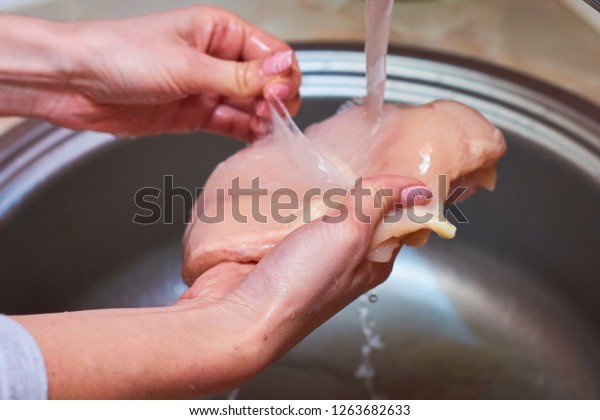 Female Washing Hands Chicken Breast Kitchen Stock Photo