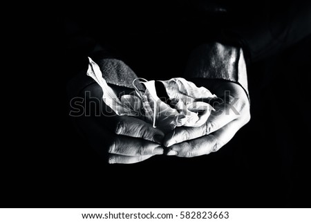 Similar – Close-up of a man’s hand holding a dried leaf of quercus