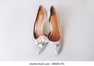 Female wedding footwear isolated over white background.