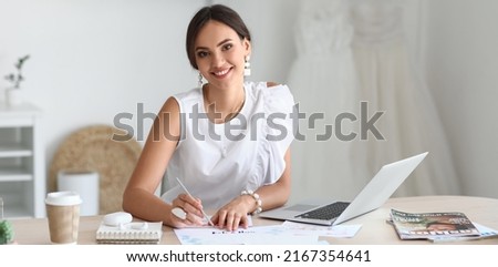Female wedding planner working in office. Banner for design
