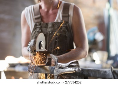 Female Welder In A Metal Shop