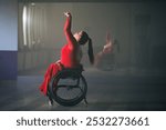 Female wheelchair dancer performing beautiful elegant choreography at a dance studio. Disability sport concept.