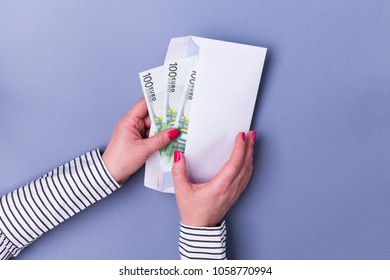 Female (woman) Hands Holding Envelope With Cash. Euro Banknotes