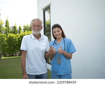 female woman lady girl son thump up man male olderly person peolple human thumb up cheerful pointing finger body part look at camera health care treatment patient happy smile service hospital clinic