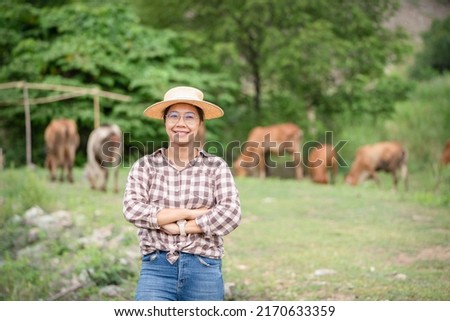 Female Woman worker posing on a cow dairy farm out door ranch a cowshed farm