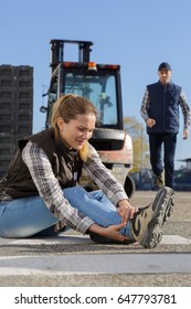 Female Worker With Ankle Injury