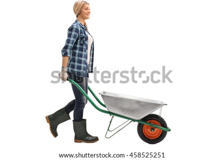 Female worker pushing an empty wheelbarrow isolated on white background