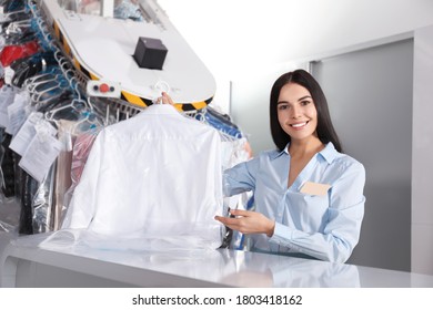 Female Worker With Shirt At Modern Dry-cleaner's