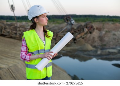 female worker stands with drawings on a background of career Stacker