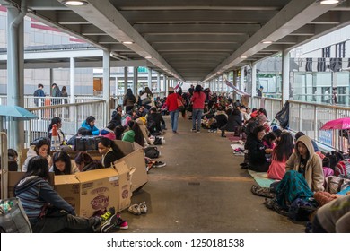 Female workers from Indonesia and the Philippines gathering on Sunday on a walkway in Admiralty distric. Hong Kong, January 2018