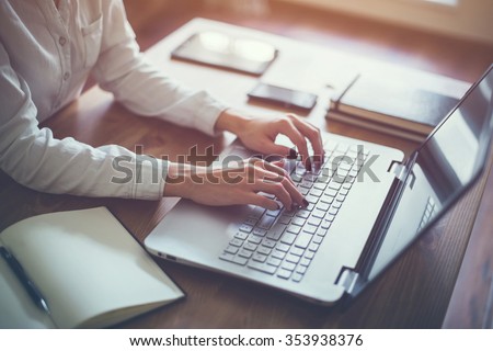 Female working with laptop at home woman's hands on notebook computer Writer blogger designer telework