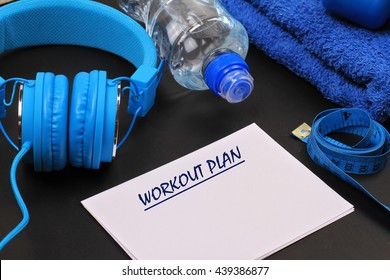 Female Workout Plan, Dumbbells And Headphones . Woman Weight Loss, Body Toning Concept. Fitness, Sport, Challenge Background