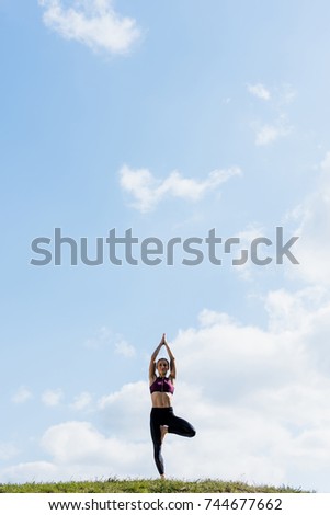 Similar – Woman doing a handstand on the beach