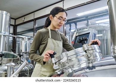 Female young engineer working on equipment - Powered by Shutterstock