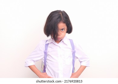 Female Young Student In Her School Uniform Looking Unhappy To Get Back To School After Long Semester Holiday