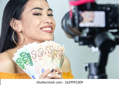 Female youtuber making money by doing youtube concept.