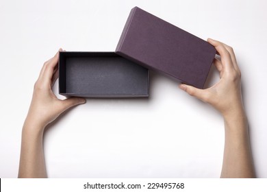 A Female(woman, Girl) Two Hands Hold And Open The Empty(blank) Wine Box Isolated White, Top View At The Studio.