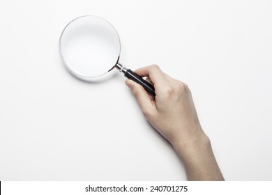 A Female(woman) Hand Hold A Magnifier(reading Glass) Isolated White At The Studio.