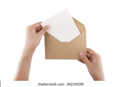 A Female(woman) Hand Hold(open) A Envelope And Post Card On The Wood Desk, Top View At The Studio.