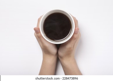 Female(woman) Two Hands Hold A White Take Out Cup With Coffee(americano) Isolated White And Top View.