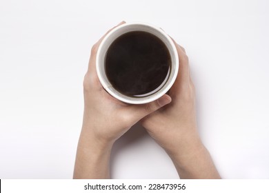 Female(woman) Two Hands Hold A White Take Out Cup With Coffee(americano) Isolated White And Top View.