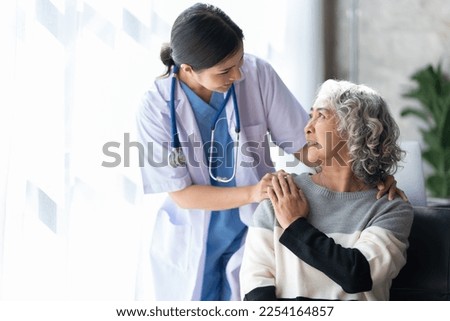 Femalr doctor give empathy encourage retired patient sit on sofa at home hospital.
