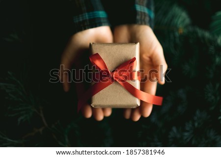 Femele hands holding gif boxt. Ideas for christmas decoration and gifts. Christmas and New year concept. 
