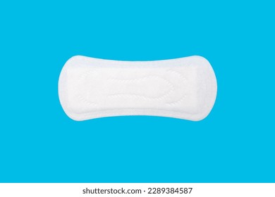 Feminine hygiene menstrual pad for the menstrual cycle on a blue background. Feminine hygiene product in the form of a sanitary napkin. A clean menstrual pad is positioned horizontally - Shutterstock ID 2289384587
