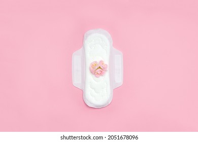 Feminine Sanitary Napkin With Pink Flowers. First Menstruation Concept. Copy Space.