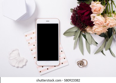  feminine tabletop flatlay with smartphone mock-up
