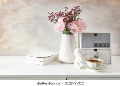 Feminine wedding or birthday table mockup scene with floral bouquet.  greeting card, cup of coffee and books. - Shutterstock ID 2129795312