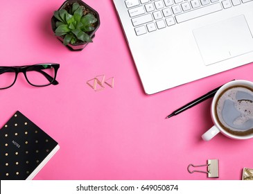 Feminine workplace concept. Items on bright pink background, top view